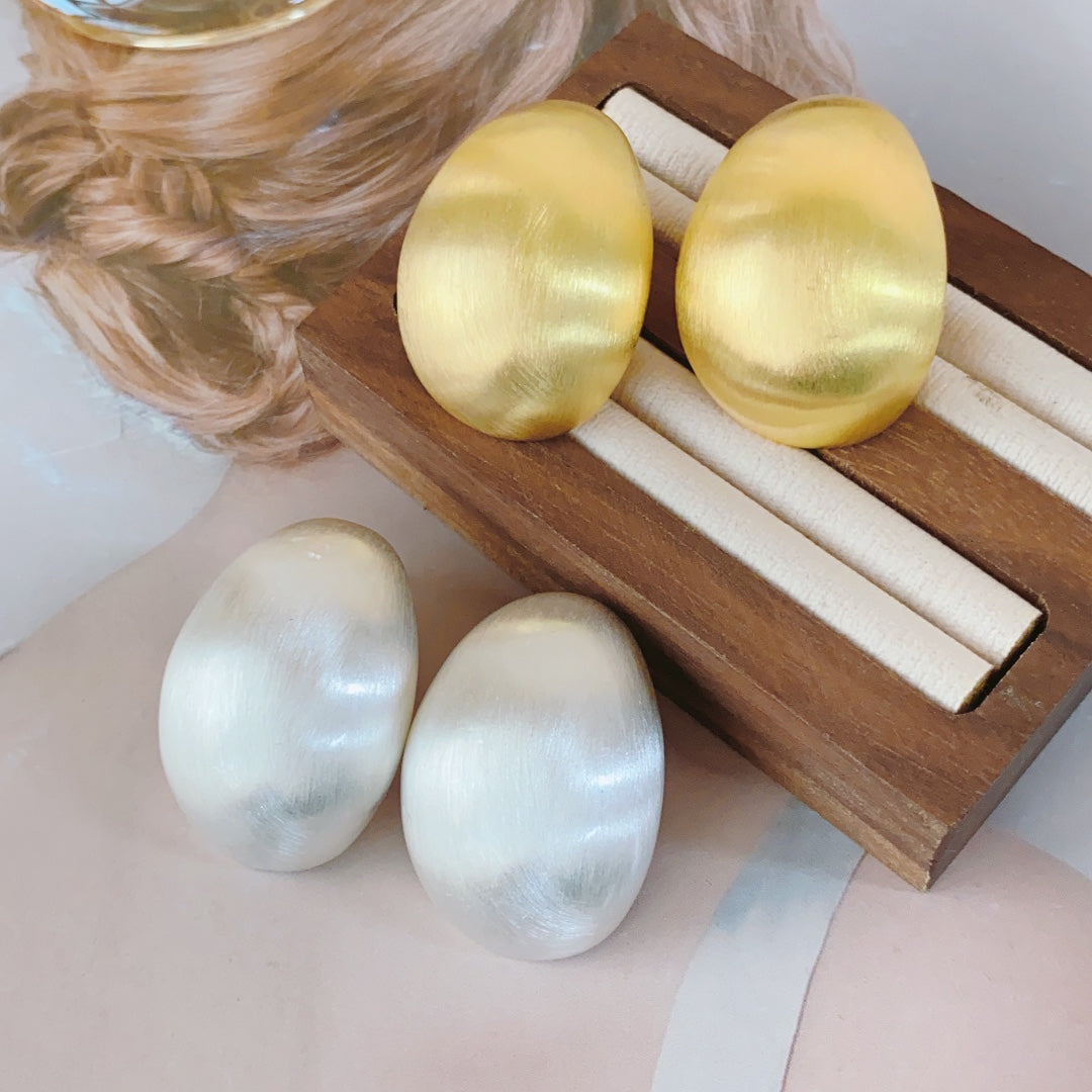 Pendientes de huevo de paloma: joyas llamativas y elegantes para mujeres