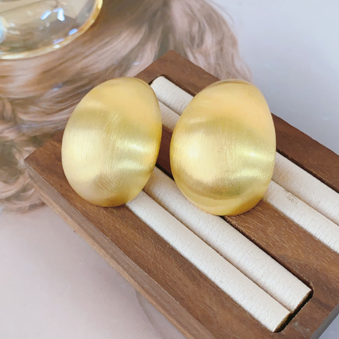 Pendientes de huevo de paloma: joyas llamativas y elegantes para mujeres