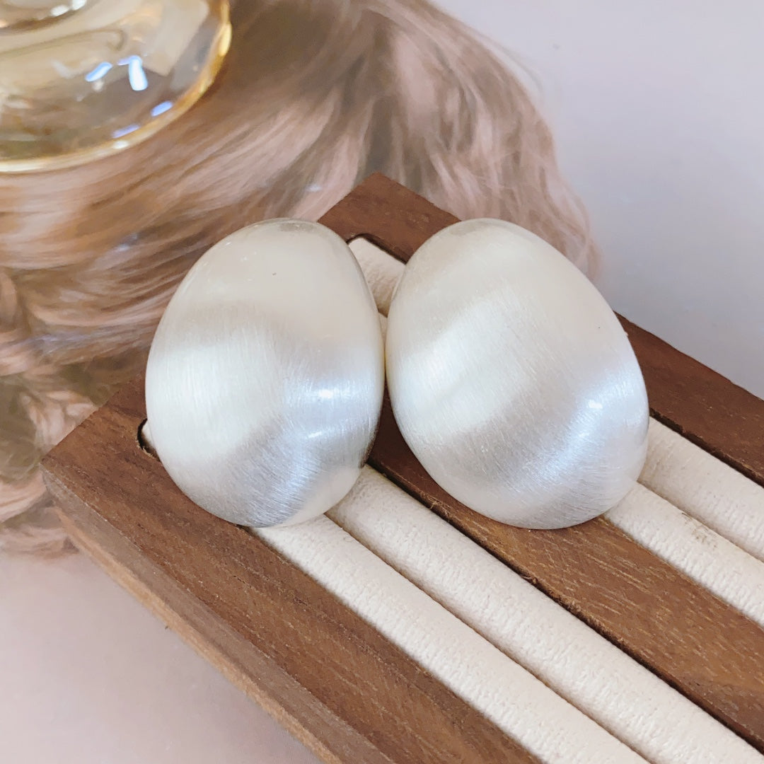 Pendientes de huevo de paloma: joyas llamativas y elegantes para mujeres